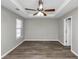 Spacious bedroom with ceiling fan and vinyl plank flooring at 533 Halley Way, Stockbridge, GA 30281