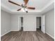 Bright bedroom featuring ceiling fan and hardwood floors at 533 Halley Way, Stockbridge, GA 30281