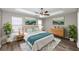 Main bedroom with wood flooring, ceiling fan, and decor at 533 Halley Way, Stockbridge, GA 30281