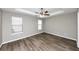 Simple bedroom with wood flooring and ceiling fan at 533 Halley Way, Stockbridge, GA 30281