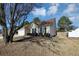 House exterior with a two-car garage and landscaped yard at 533 Halley Way, Stockbridge, GA 30281