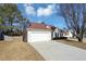 House exterior showcasing a two-car garage and driveway at 533 Halley Way, Stockbridge, GA 30281