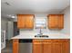 Kitchen with double sink, oak cabinets, and white countertops at 533 Halley Way, Stockbridge, GA 30281