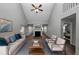 Living room with vaulted ceiling, fireplace, and comfy furniture at 533 Halley Way, Stockbridge, GA 30281