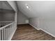 Bright loft area with grey walls and wood flooring at 533 Halley Way, Stockbridge, GA 30281