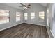 Sunroom with grey walls, wood-look flooring, and many windows at 533 Halley Way, Stockbridge, GA 30281