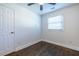 An empty bedroom features a ceiling fan, a window with blinds, a door, and clean white walls at 116 Turman Se Ave, Atlanta, GA 30315