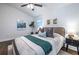 Cozy bedroom with stylish decor, including a ceiling fan, plants, and comfortable furnishings at 116 Turman Se Ave, Atlanta, GA 30315