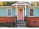 Charming home with a colorful front door and brick foundation at 116 Turman Se Ave, Atlanta, GA 30315