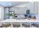 Kitchen featuring white quartz countertops, stainless steel appliances, and barstool seating at 116 Turman Se Ave, Atlanta, GA 30315