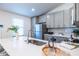 Well-lit kitchen with quartz countertops, stainless appliances, and modern fixtures at 116 Turman Se Ave, Atlanta, GA 30315