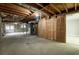 Unfinished basement with exposed beams and storage at 1792 Hammond Woods Sw Cir, Marietta, GA 30008