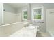 Clean bathroom with white tile and vanity at 1792 Hammond Woods Sw Cir, Marietta, GA 30008