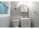 Clean bathroom featuring a vanity, toilet and mirror at 1792 Hammond Woods Sw Cir, Marietta, GA 30008