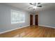 Hardwood floor bedroom with neutral walls at 1792 Hammond Woods Sw Cir, Marietta, GA 30008