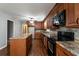 Modern kitchen with island and wood cabinets at 1792 Hammond Woods Sw Cir, Marietta, GA 30008