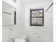 A bathroom features a window, small sink, and toilet at 320 3Rd Ne St # 1, Atlanta, GA 30308