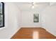 Bright bedroom features hardwood floors, a ceiling fan, and a window with natural light at 320 3Rd Ne St # 1, Atlanta, GA 30308
