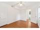 Cozy bedroom boasts hardwood floors, a ceiling fan, and an ensuite bathroom at 320 3Rd Ne St # 1, Atlanta, GA 30308