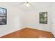 Relaxing bedroom with gleaming hardwood floors, natural light, and fresh white paint at 320 3Rd Ne St # 1, Atlanta, GA 30308