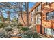Charming brick condo building with a beautiful fountain and mature landscaping in front at 320 3Rd Ne St # 1, Atlanta, GA 30308