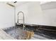 Close up of a sink with a spring faucet and black countertops at 320 3Rd Ne St # 1, Atlanta, GA 30308