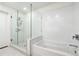 Clean bathroom with a soaking tub and a glass shower at 788 W Marietta Nw St # 1409, Atlanta, GA 30318