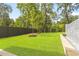 Landscaped backyard with a water feature and lush lawn at 3566 Cantrell Ne Rd, Atlanta, GA 30319