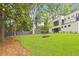 Landscaped backyard with lush lawn and modern fence at 3566 Cantrell Ne Rd, Atlanta, GA 30319