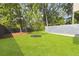 Spacious backyard with a grassy area and mature trees at 3566 Cantrell Ne Rd, Atlanta, GA 30319