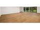 Finished basement with light oak hardwood floors and sliding glass doors at 3566 Cantrell Ne Rd, Atlanta, GA 30319