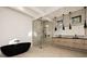 Elegant bathroom with a soaking tub, glass shower, and modern double vanity at 3566 Cantrell Ne Rd, Atlanta, GA 30319