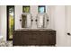 Double vanity bathroom with dark wood cabinets and marble flooring at 3566 Cantrell Ne Rd, Atlanta, GA 30319