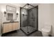 Modern bathroom with a large glass shower, floating vanity, and dark tile floors at 3566 Cantrell Ne Rd, Atlanta, GA 30319