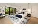 Main bedroom with large windows, plush bedding, and a sitting area at 3566 Cantrell Ne Rd, Atlanta, GA 30319