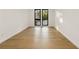 Bright bedroom with light oak hardwood floors and large windows at 3566 Cantrell Ne Rd, Atlanta, GA 30319
