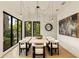 Elegant dining room with large windows and modern chandelier at 3566 Cantrell Ne Rd, Atlanta, GA 30319