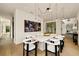Elegant dining room with a large table, modern chairs, and a statement light fixture at 3566 Cantrell Ne Rd, Atlanta, GA 30319