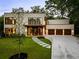 Modern home with stone and wood accents, three-car garage at 3566 Cantrell Ne Rd, Atlanta, GA 30319