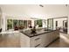Open concept kitchen with large island and views into living area at 3566 Cantrell Ne Rd, Atlanta, GA 30319