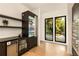 Sleek kitchen with dark wood cabinets, stainless steel appliances, and backyard view at 3566 Cantrell Ne Rd, Atlanta, GA 30319