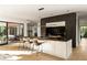Modern kitchen with a large island, dark cabinetry, and marble countertops at 3566 Cantrell Ne Rd, Atlanta, GA 30319