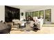 Spacious living room with large windows, fireplace, and comfortable seating at 3566 Cantrell Ne Rd, Atlanta, GA 30319