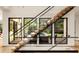 Modern staircase with glass and wood accents, offering abundant natural light at 3566 Cantrell Ne Rd, Atlanta, GA 30319