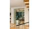 Glass-enclosed wine cellar visible from the hallway, showcasing wine bottles at 3566 Cantrell Ne Rd, Atlanta, GA 30319