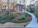 Brick house with a large driveway and landscaped yard at 5615 Forkwood Nw Dr, Acworth, GA 30101