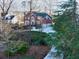 Brick house with a large driveway and landscaped yard at 5615 Forkwood Nw Dr, Acworth, GA 30101