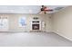 Spacious finished basement with fireplace and ceiling fan at 5615 Forkwood Nw Dr, Acworth, GA 30101