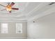 Main bedroom with tray ceiling, hardwood floors and window at 5615 Forkwood Nw Dr, Acworth, GA 30101