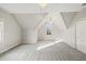 Charming bedroom with vaulted ceiling, carpet, and window at 5615 Forkwood Nw Dr, Acworth, GA 30101